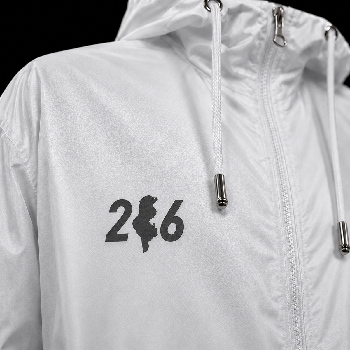 Indicatif 216 avec carte de la Tunisie sur veste blanche, détail